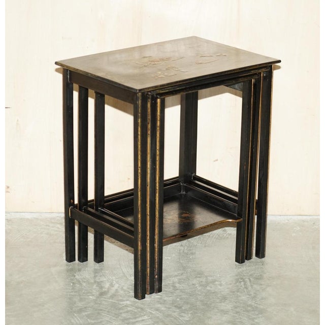 This lovely nest of three original Chinese Chinoiserie black lacquered tables. A good looking, decorative and well-made...
