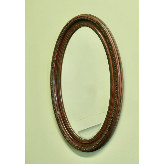 Large Edwardian Wood Finish Oval Mirror This Mirror has a 3” wide moulded oval frame, this has a Simulated Wood finish The...