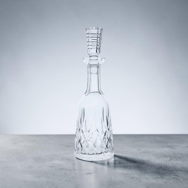 An authentic Waterford Crystal tall wine decanter in the iconic Lismore pattern, handcrafted in Ireland from full lead...