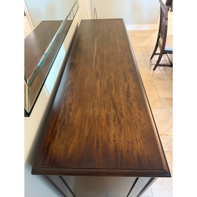 2015 Ethan Allen Brandt Buffet. Finish color is Cello. There is no visible wear and tear. This piece has been largely unused.