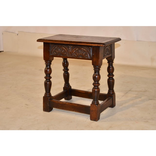 19th century oak joint stool from England. The top has nice graining and is fastened with hand cut nails. It has a beveled...