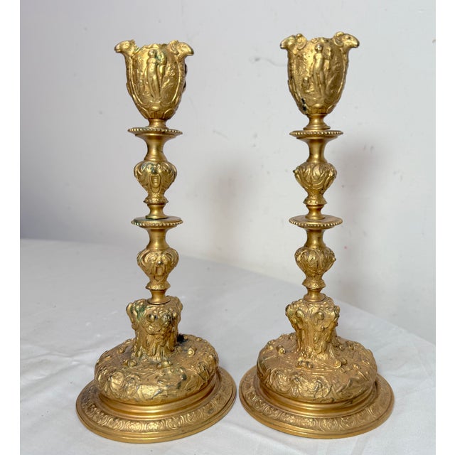 Up for sale is a lovely pair of antique ornate 19th century figural candlesticks. These French candle holders are cast out...