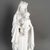 Early 20th-century sculpture depicting the Virgin Mary with the infant Jesus, made of biscuit porcelain. H: 53.5 cm, D: 20 cm