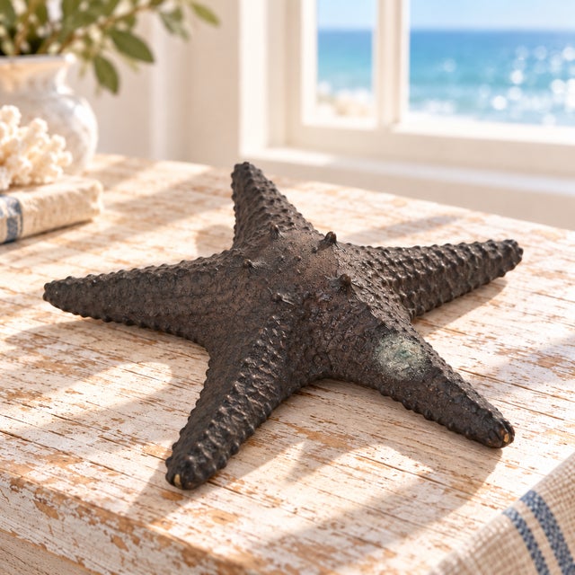Bring sculptural coastal character to your home with this Maitland-Smith starfish. Five tapered arms surround a raised...