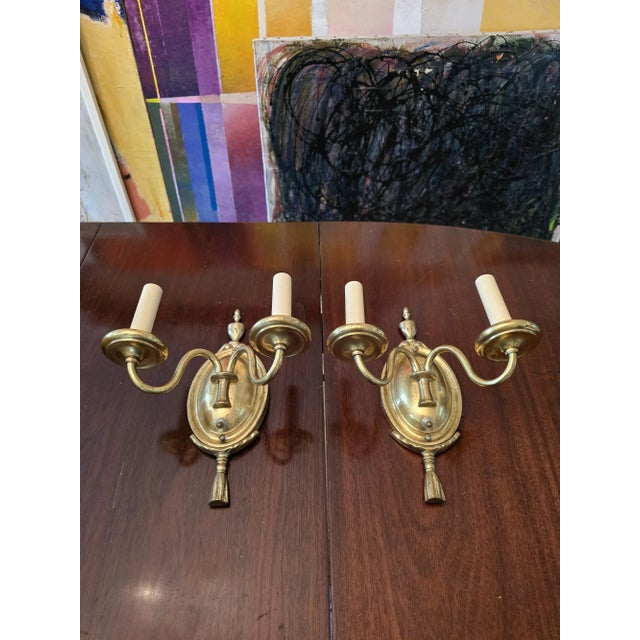 A vintage decorative pair of mid century caldwell style sconces. Having a gold plated patina now nicely tarnished...
