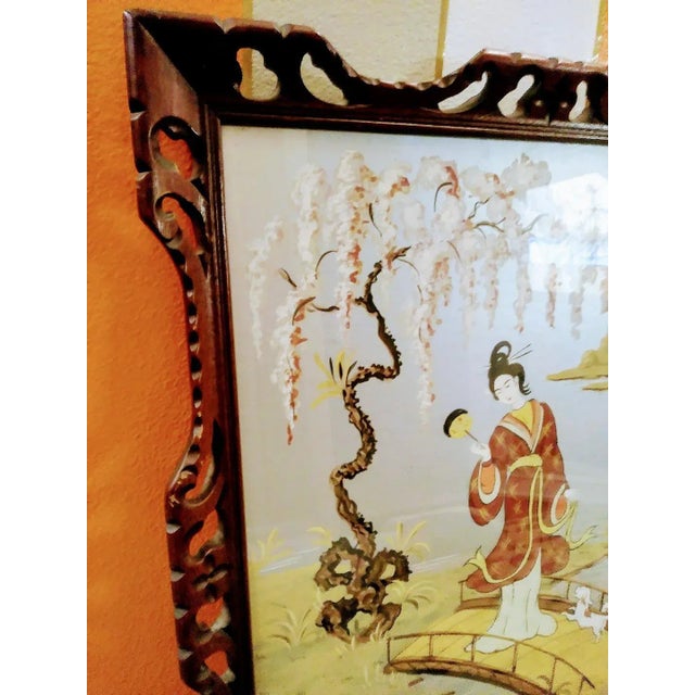 A stunning painting featuring a Geisha standing on a cross bridge in a beautiful garden with a little pup.. This painting...