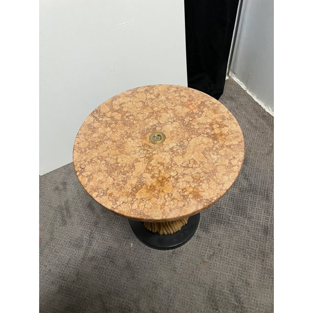 1950s Italian drink or martini table with sienna marble top. Base is made from resin with a black wood base. Great table...