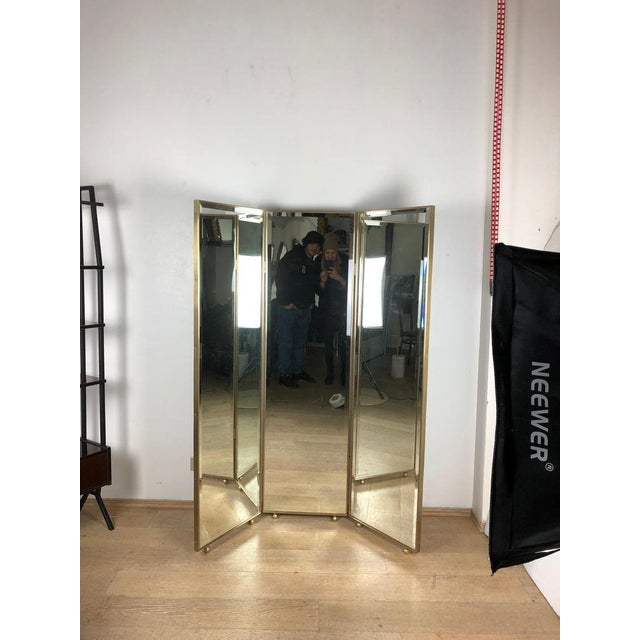 Art deco style mirrored three panels brass frame screen screen composed by three mirrored panels and brass frames. Ideal...