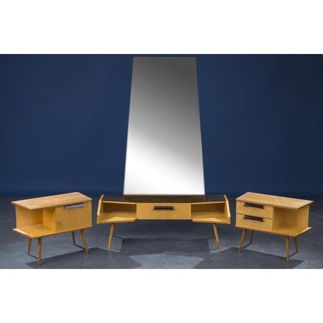 A set of bedside tables and dressing tables. The mirror of the dressing table has silvering and dents. Glass-covered tops,...