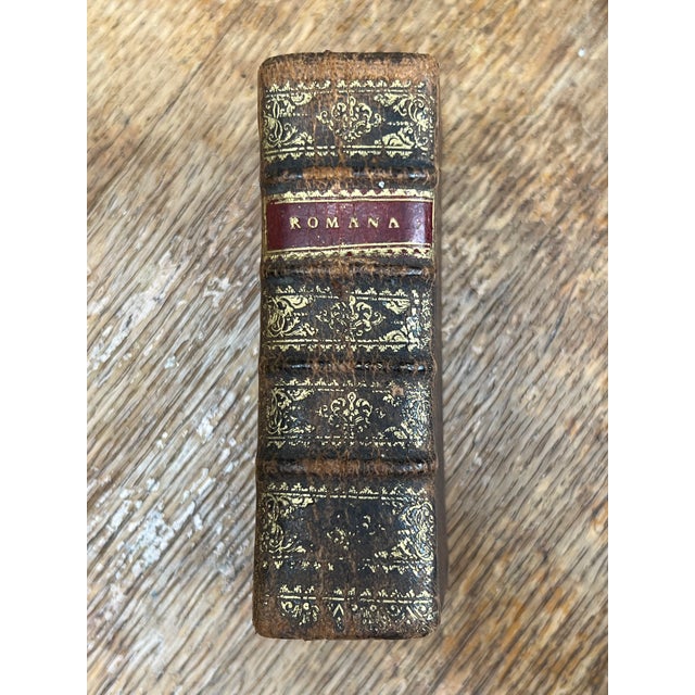 An extraordinary and highly evocative piece of early 17th-century printing, this antique miniature volume titled...
