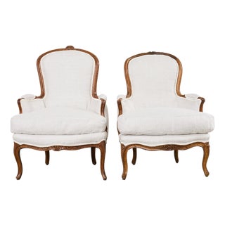Pair of French Louis XV Style Walnut Bergeres With Linen For Sale