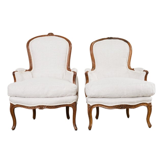 Pair of French Louis XV Style Walnut Bergeres With Linen For Sale