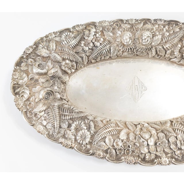 We are selling this gorgeous repousse Baltimore silver bowl. This bowl features intricate flower decoration including...
