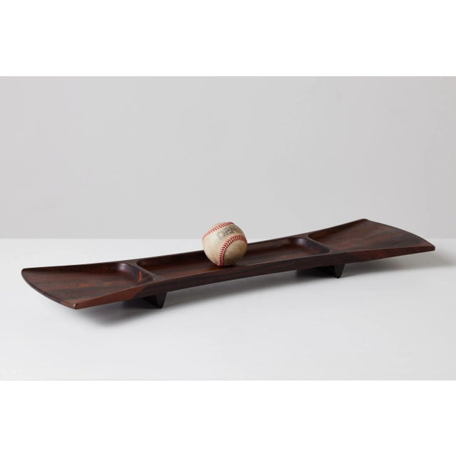 A "bow tie" tray designed by Jens Quistgaard for Dansks Rare Woods collection, c.1960s, Denmark features sculpted...