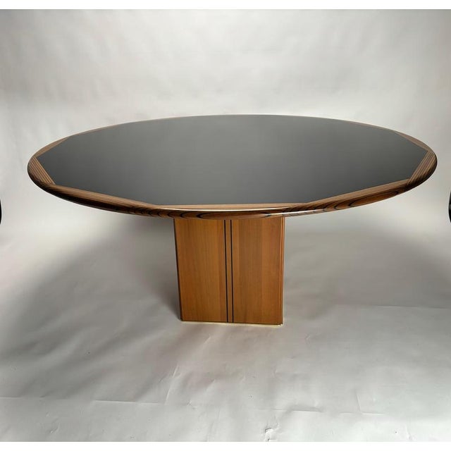 Artona dining table by Afra & Tobia Scarpa, crafted by Maxalto in Italy, 1975. Featuring a round walnut top with dark...