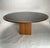 Artona dining table by Afra & Tobia Scarpa, crafted by Maxalto in Italy, 1975. Featuring a round walnut top with dark...