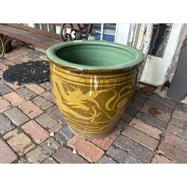 This large vessel features a dragon motif and a beautiful turquoise interior. This would serve as a wonderful planter, or...