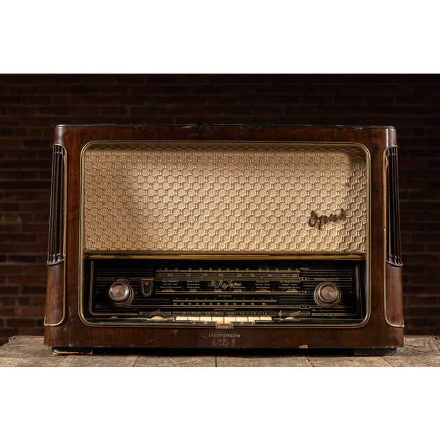 Overall dimensions of 25"W x 11"D x 16.5"H. Marks include minor wear and scratches to the exterior case. This radio...