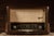 Overall dimensions of 25"W x 11"D x 16.5"H. Marks include minor wear and scratches to the exterior case. This radio...
