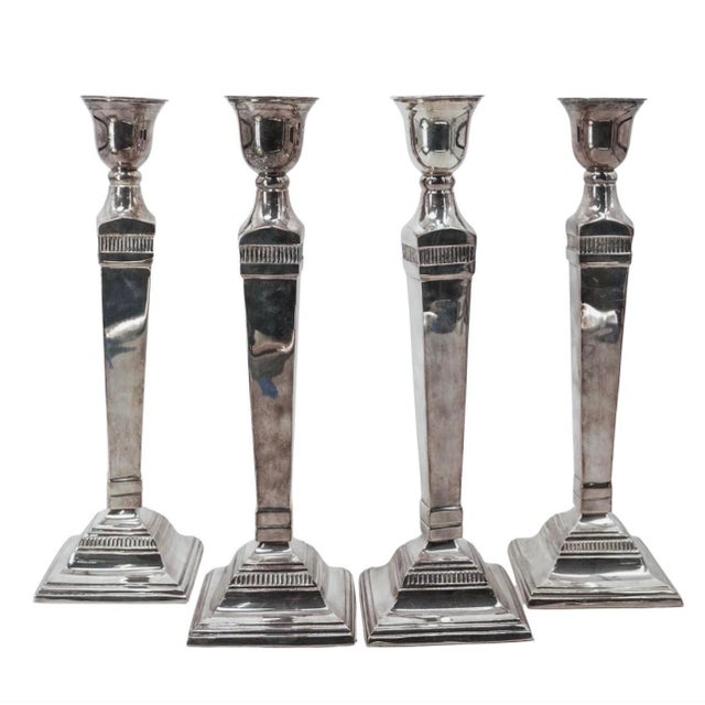 (4 pcs) Pottery Barn Silver Plated Candlesticks Late 20th-early 21st century, American A set of four silver-plated tapered...