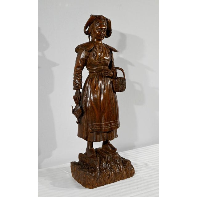 Important subject in carved beech dating from the late nineteenth century. This work depicts a Breton woman dressed in...
