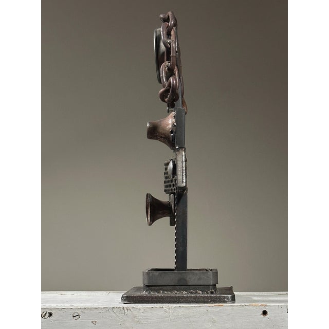 Vintage Brutalist Found Object Assemblage Metal Sculpture. Welded steel anthropomorphic sculpture cladded with perforated...