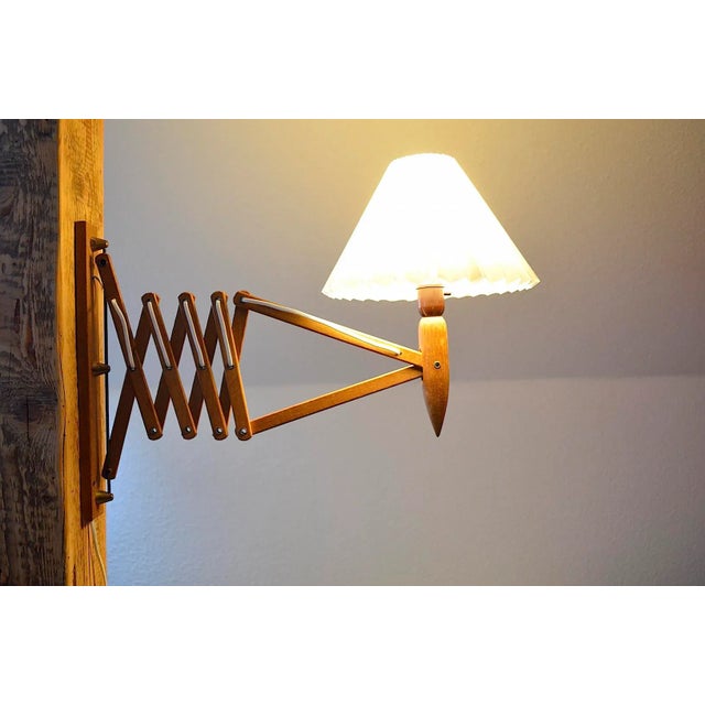 Large Mid Century wall lamp by Danish designer Kaare Klint for Le Klint. The wall lamp is a large version with the mass...