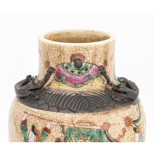 Pair of Chinese Nankin Porcelain Vases, each hand-enameled with warriors at battle on crackle glazed ground, unmarked. 10"...