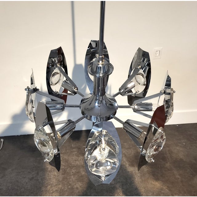 Classic Mid-Century 8 light glass and chrome Chandelier by Italian designer Oscar Torlasco. Made in Italy circa 1960s....