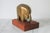 Vintage brass elephant on wood stand. No makers mark. Minor age wear, some patina.