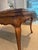 French Régence Provincial-style walnut draw-leaf table crafted with a beautifully hand-hewn top and breadboard ends,...