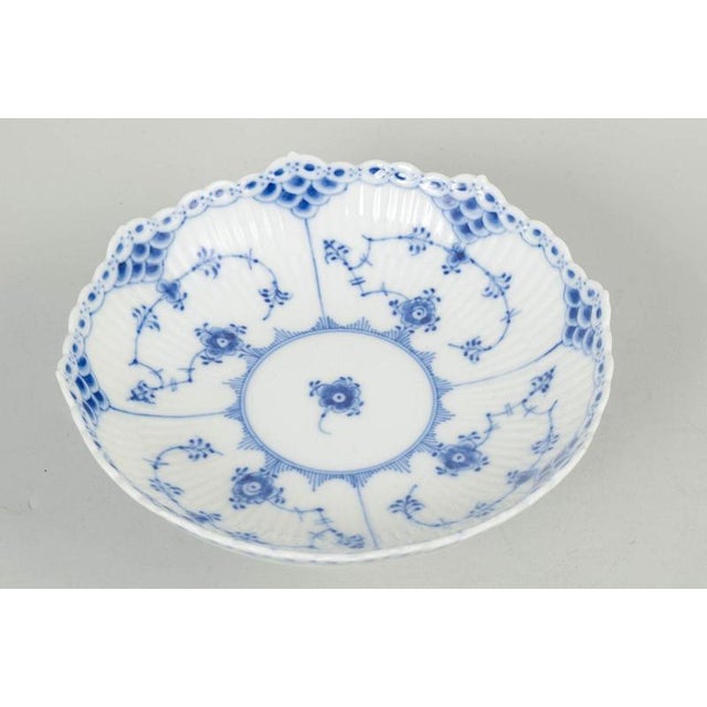 Royal Copenhagen Blue Fluted Half Lace low bowl model 1/511. Elegant low porcelain bowl in Blue Fluted Half Lace with...