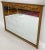 Large antique Art Nouveau style carved gilt wood framed wall or mantle mirror. This piece has a quiet elegance with great...