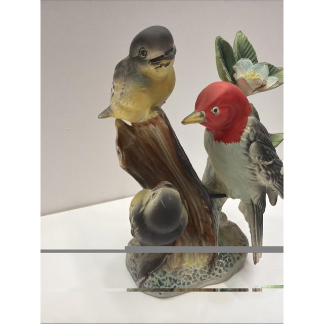 Vintage Enesco Japan ceramic figurine featuring a detailed woodpecker bird family perched on a tree trunk with floral...