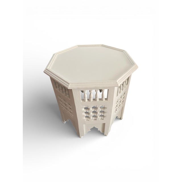 This octagonal side table is a testament to the storied woodworking traditions of Marrakech. Entirely handmade from solid...