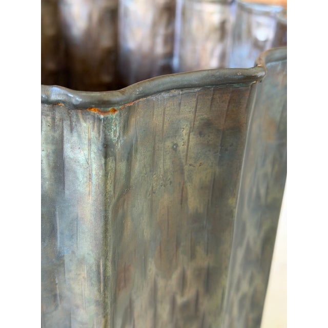 An exceptional mid-century Italian hammered brass jardiniere or umbrella stand designed by Egidio Casagrande for...