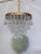 Introduce romance and rich vintage texture to your home with this enchanting mid-century tiered brass French pendalogue...