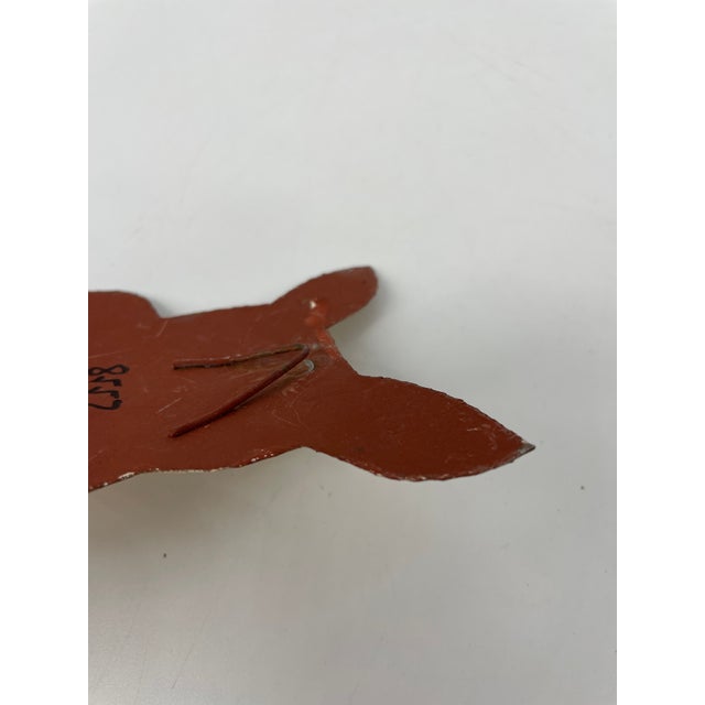 Whimsical rabbit is clutching his easter egg and look like he is up to something! Attach to wall using hook on back.