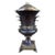 Neoclassical style table lamp in the form of a leather clad urn with bronze peacocks on either side joined by a decorative...