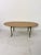 Oval brass coffee table with a marble top, 1950s. Intact and in good condition. Width 116 cm, depth 48 cm, height 42 cm.