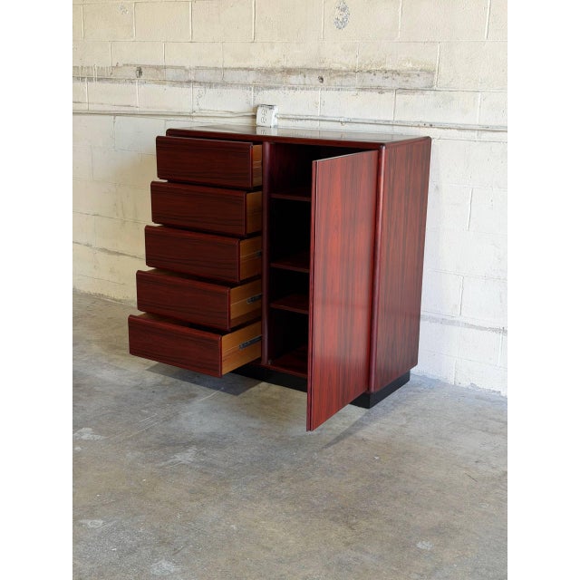 This gentleman chest presents a highly functional dual-zone storage solution. The asymmetrical design pairs stacked...
