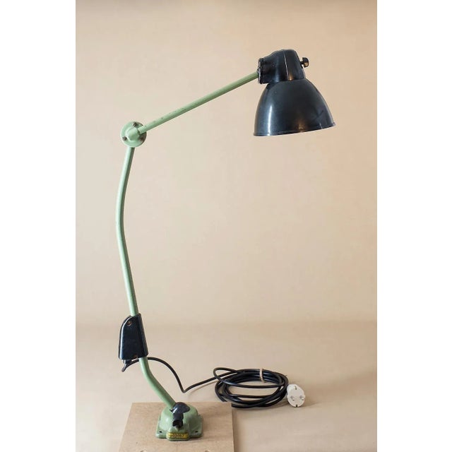 This industrial lamp made by VEB Leuchtenbau Leipzig was designed in Bauhaus style in the 1950s as a workshop lamp. Their...