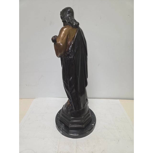 This beautifully crafted bronze statue depicts the Sacred Heart of Jesus with remarkable reverence and detail. Standing 19...