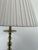 A refined pair of Ralph Lauren buffet lamps featuring a warm antique brass finish and elegantly turned ball-form stems....