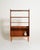 Teak frame with adjustable shelves and tapered solid wood legs. Original label present. Made by Bränntorps, 1950s-1960s....