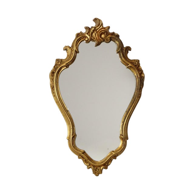 Large vintage mirror with a crest, designed in a classic Baroque style; made in France during the second half of the 20th...