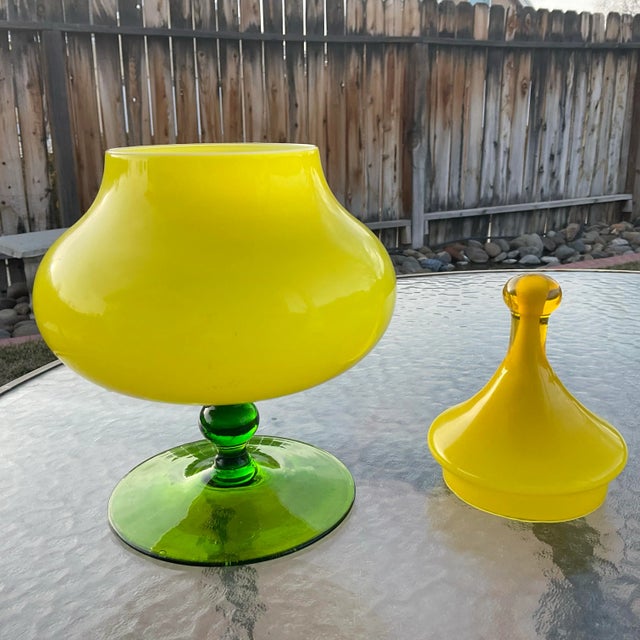 Mid-Century Empoli Apothecary Jar with yellow cased body and a green pedestal and the usual circus tent lid.Very unusual...