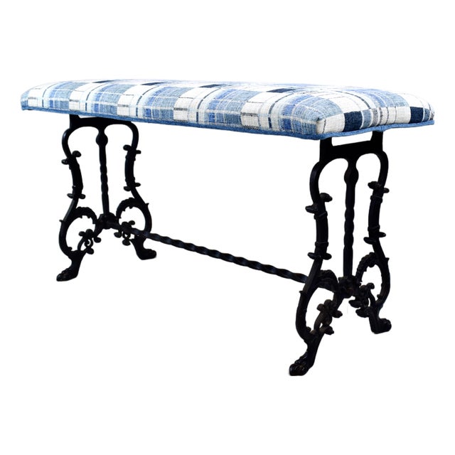 A sweet antique Cast Iron bench in new blue & white woven upholstery. Versatile, solid mid size ready for use.