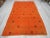 Handwoven orange kilim rug. In very good condition. Approximately 45-55 years old.