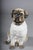 Life-size ceramic pug dog, England, 20th century This antique-inspired ceramic pug figurine in the Staffordshire style...